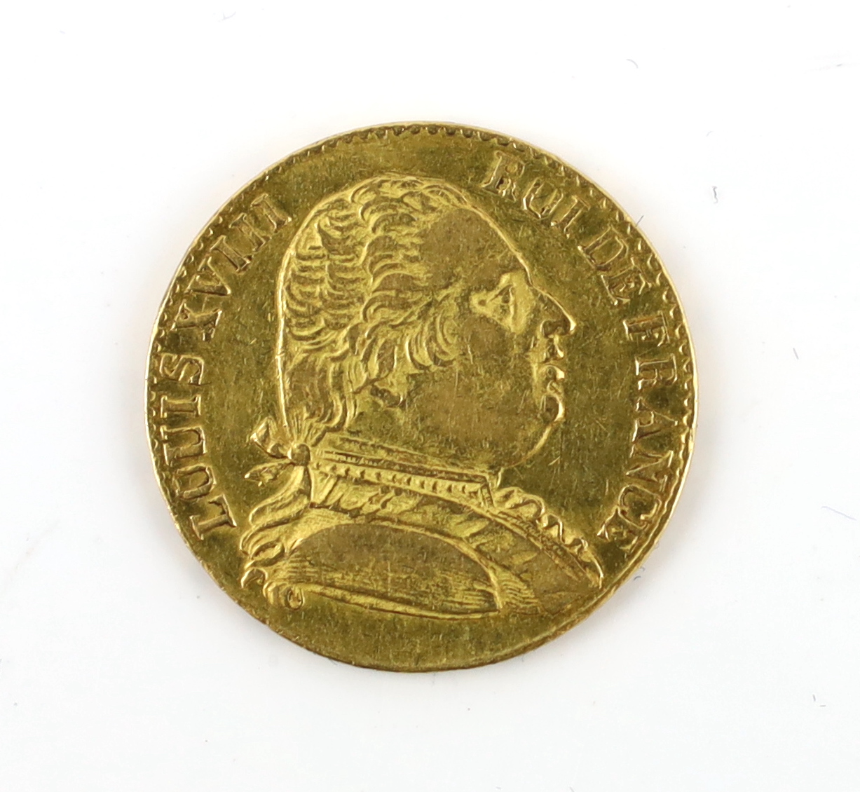 Gold coins, Louis XVIII 20 Francs London Mint, 1815R, probably demounted at the 12 o’clock position, otherwise good VF